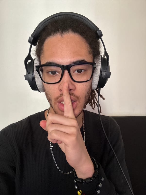 Person makes quiet gesture in Paris