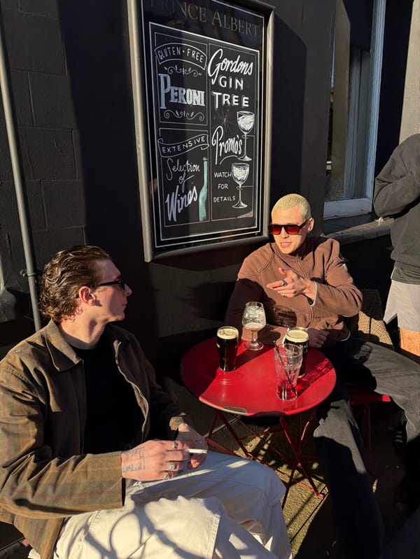 Men gather for afternoon drinks at London pub