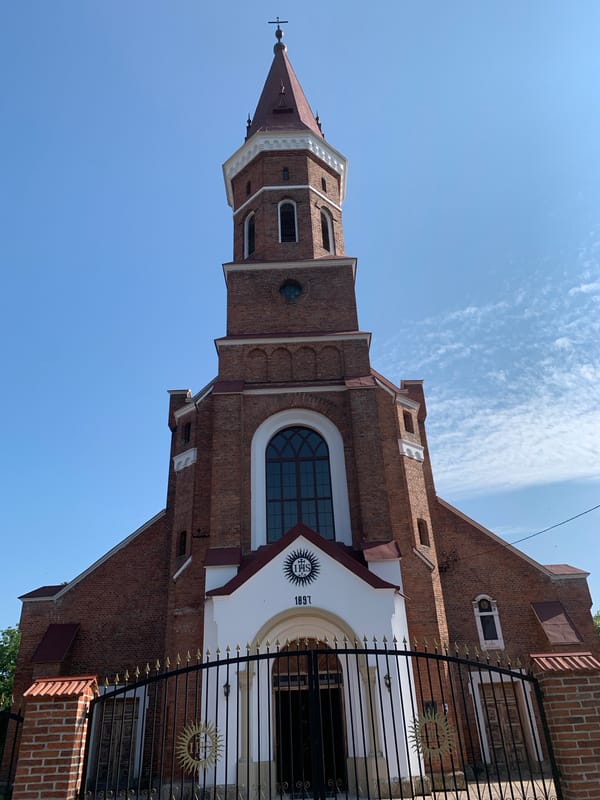 Two historic Catholic churches and summer blooms in Kolomyia