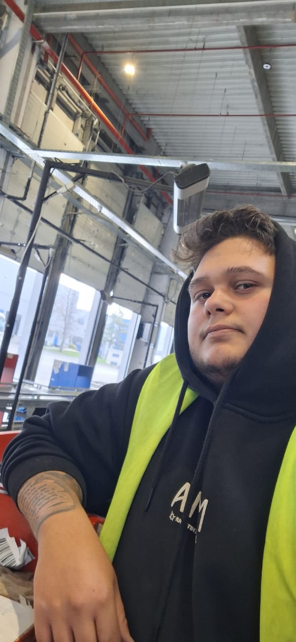 Worker in safety vest spotted in industrial building, Varna