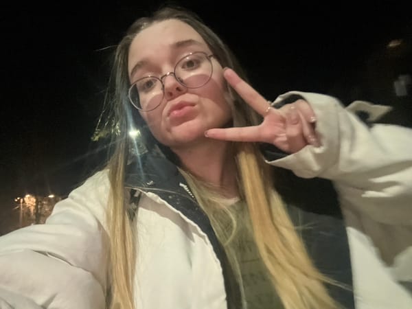 Nighttime selfie session on illuminated walkway in Pushchino, Russia