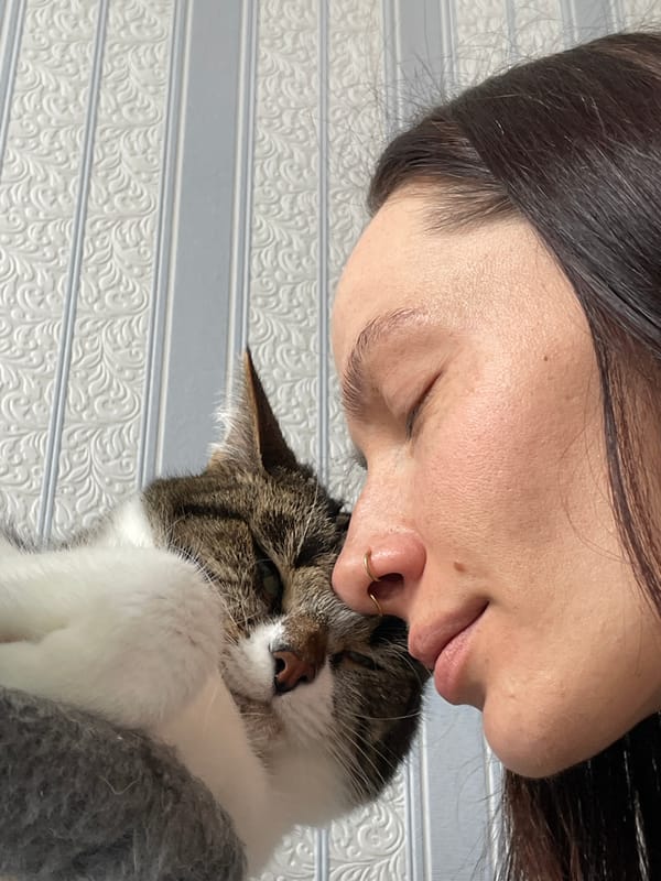 Woman and cat share quiet moment in Izhevsk