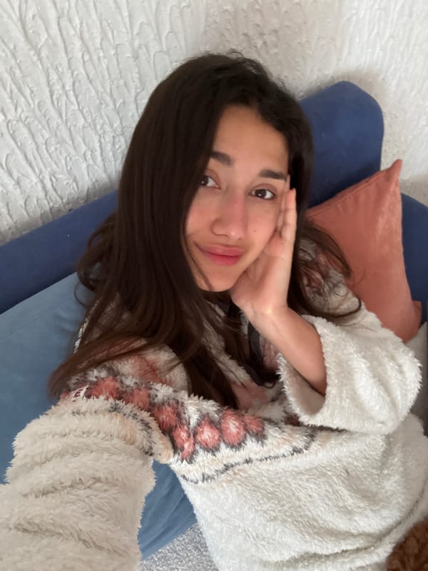 Woman and poodle share quiet morning moment in Sutomore