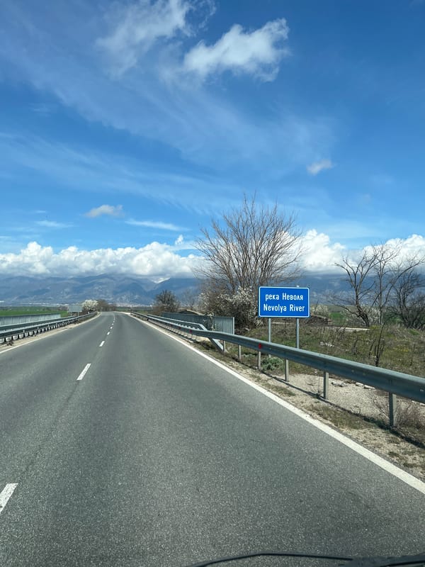 Vehicle travels highway near Nevolya River in Banya, Bulgaria