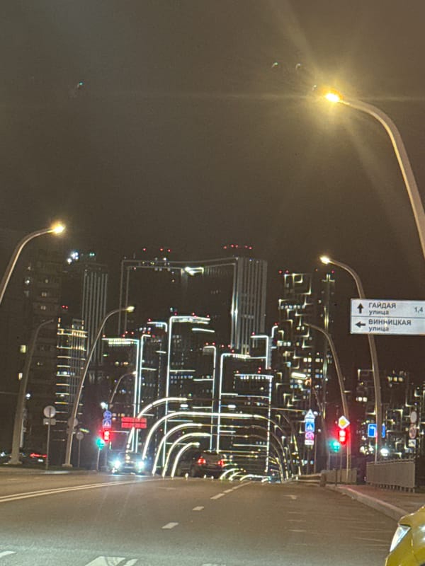 Moscow nighttime cityscape documented from moving vehicle