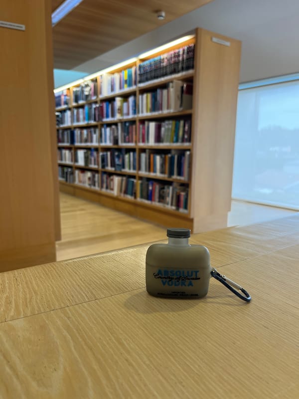 Branded AirPod case spotted in Portuguese library setting