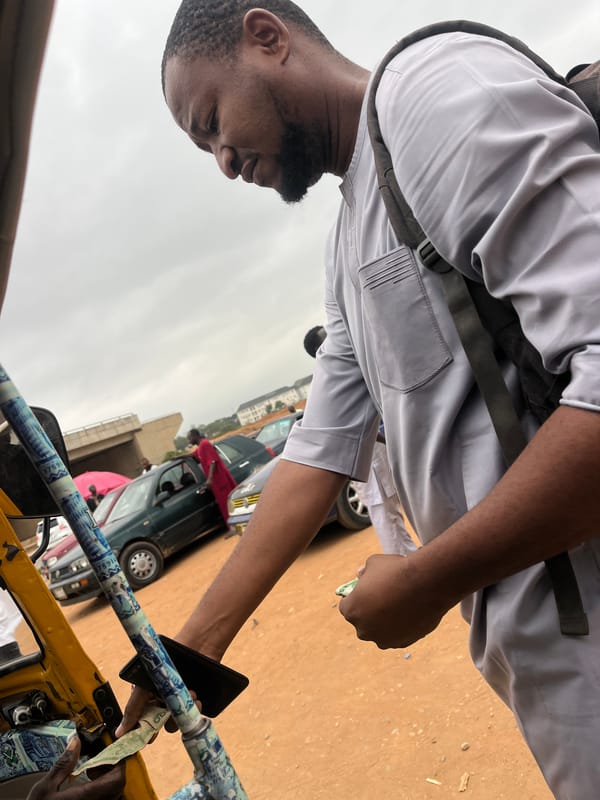 Yellow taxi and street transaction witnessed in Nigerian village