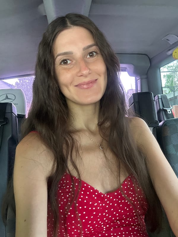 Woman in polka-dot dress photographed in vehicle, Wisła