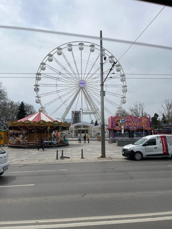 Carnival rides spotted alongside roadway with parked van
