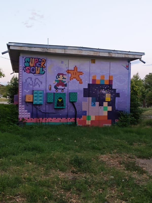 Street murals in Stara Zagora span retro gaming and cosmic themes