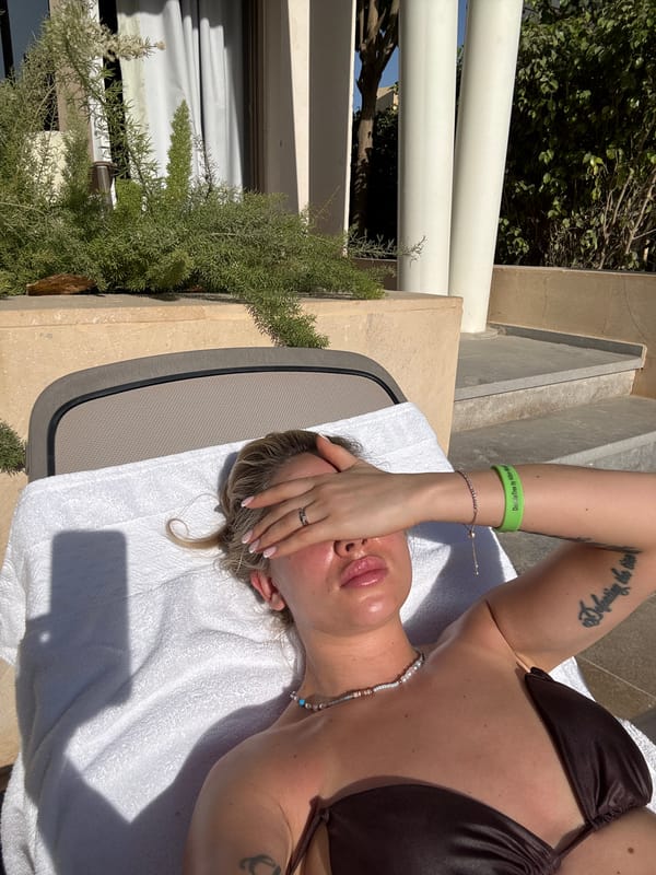 Woman relaxes poolside in Egyptian resort town El Gouna