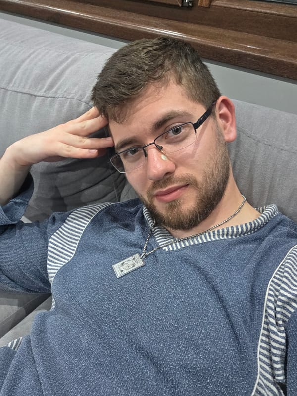 Man relaxes on couch with book in Bulgarian home