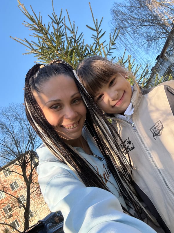Woman and child enjoy sunny afternoon selfies in Rusanovo