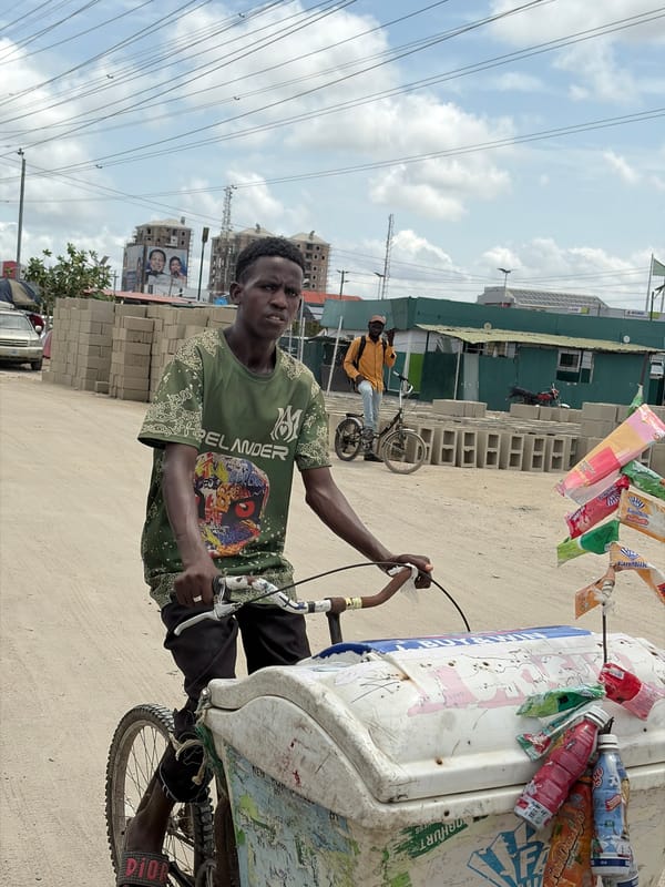 Ice cream vendor operates bicycle cart in Igboefon, Nigeria