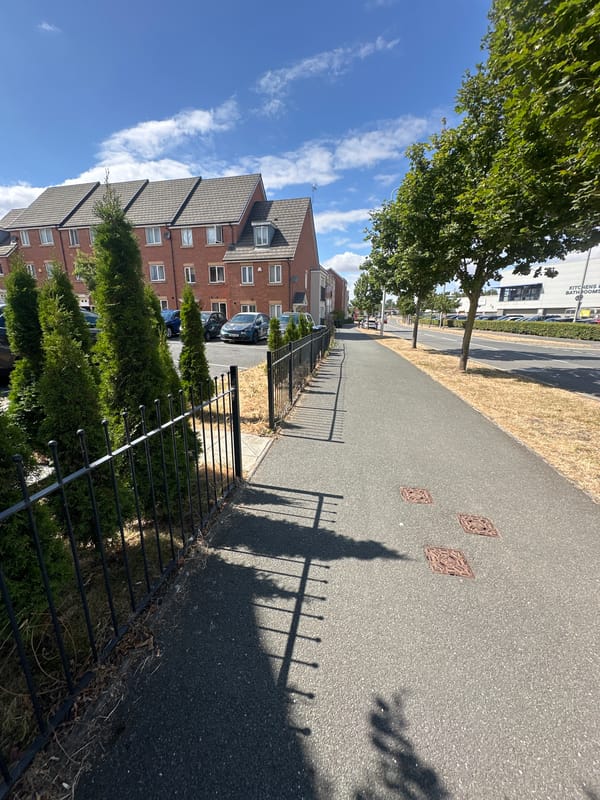Quiet residential street on a sunny day in Rugby