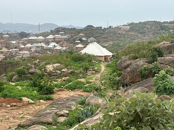 Residential construction activity documented in rocky Jos, Nigeria neighborhood