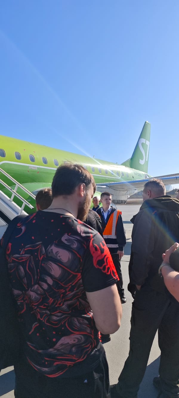 Passengers board S7 Airlines flight at Talakan Airport