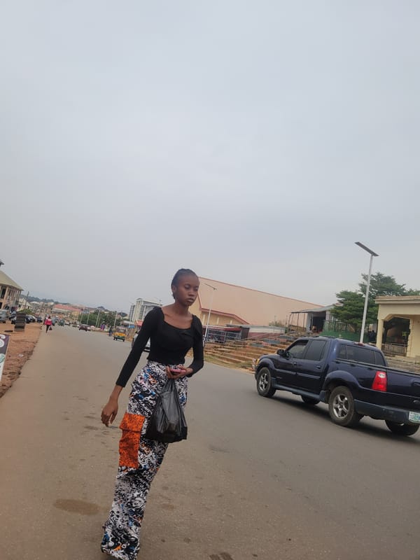 Daily life unfolds on Jos streets under cloudy skies