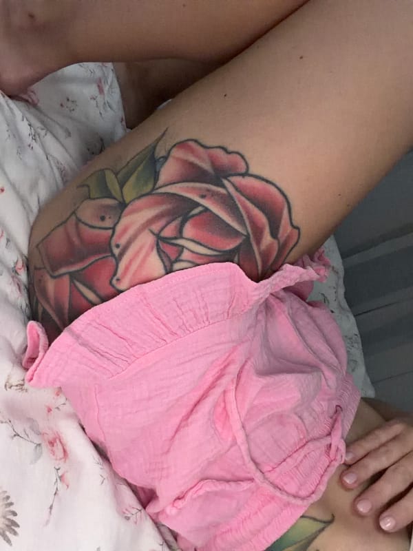 Bedroom photos with floral bedding and tattoo details