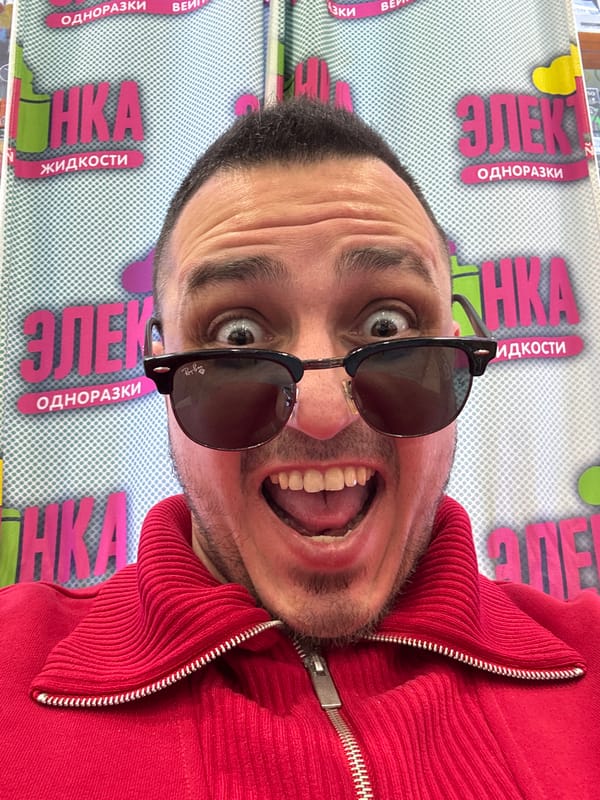 Man Takes Selfies Near Electronics Store in Saint Petersburg