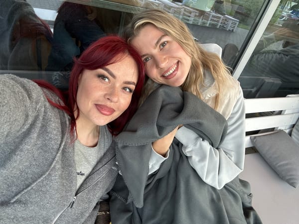 Friends share coffee and photos at Tolyatti cafe