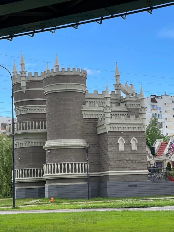 Strolling past a fairytale-style building on a Moscow promenade