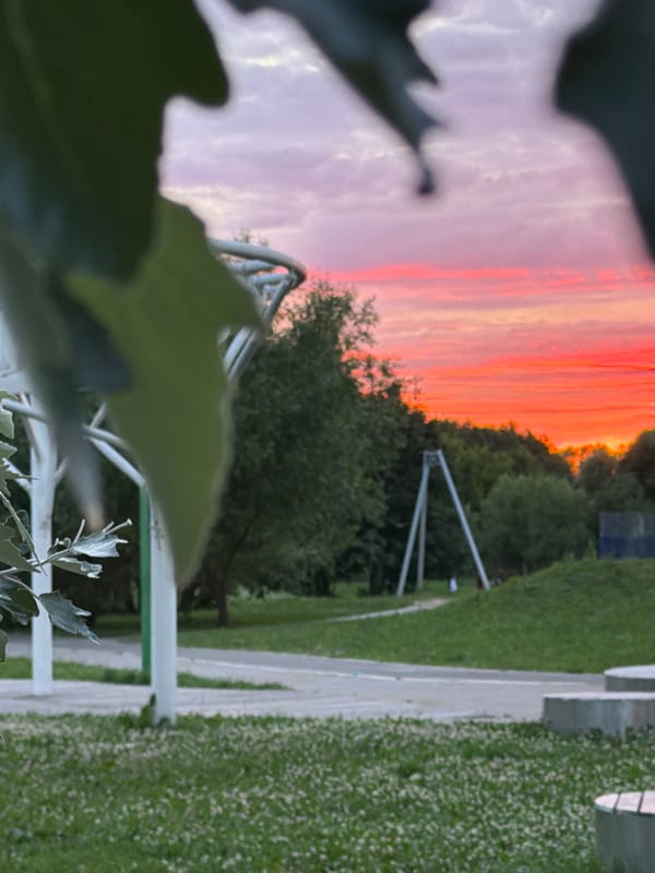 Kazan parks and streets under a blazing summer sunset