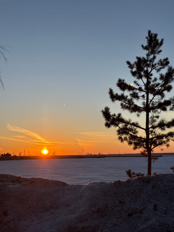 Winter sunset documented across Chaikovsky, Russia industrial waterfront areas