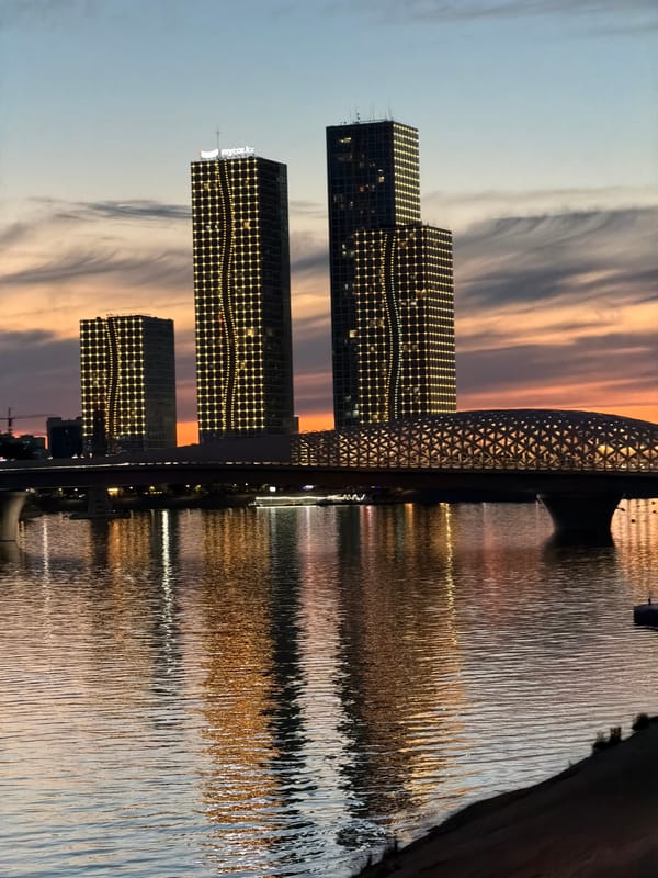 Astana skyline and waterfront illuminated at twilight