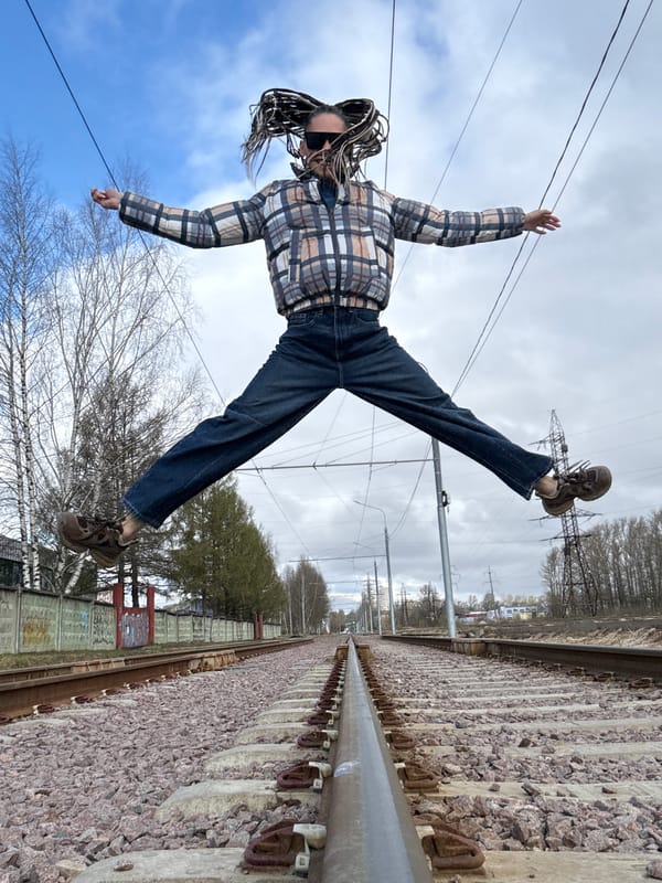 Person poses on railway tracks in Rusanovo, Russia