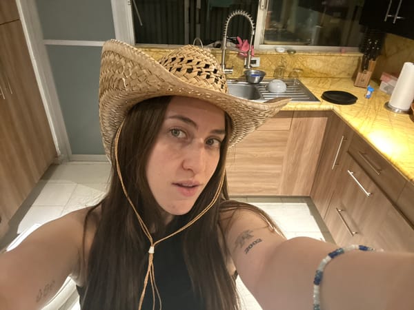 Woman takes playful selfies in Mexico City kitchen