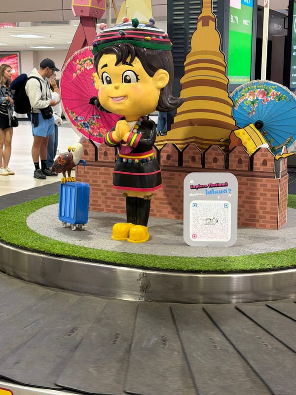 Bangkok airport baggage claim features traditional Thai cultural display