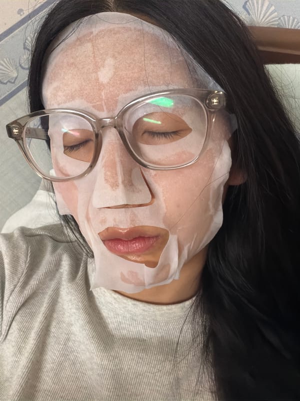Woman uses facial sheet mask in Kawasaki