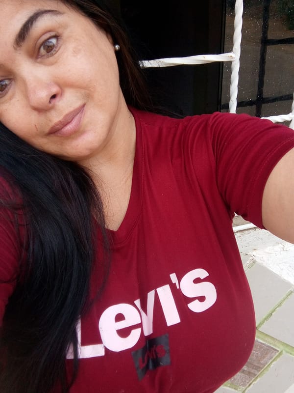 Person Takes Selfie Outdoors Near Window Frame