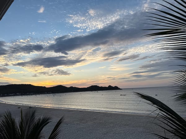 Sunset over a calm bay, caught from several angles