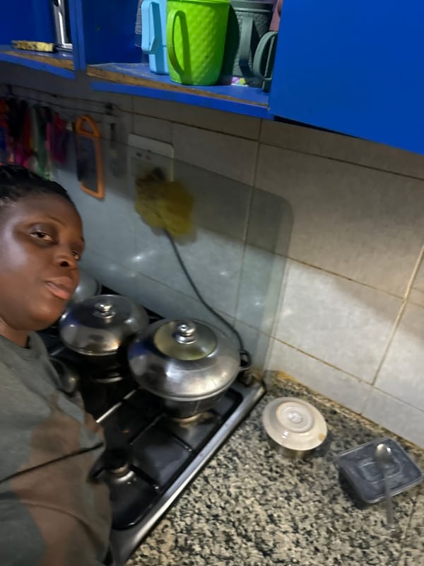 Woman photographed in kitchen in Sabon Tasha, Nigeria