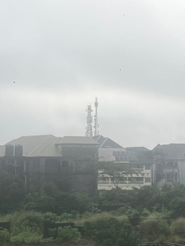 Dense greenery and infrastructure in overcast Ihiagwa, Nigeria