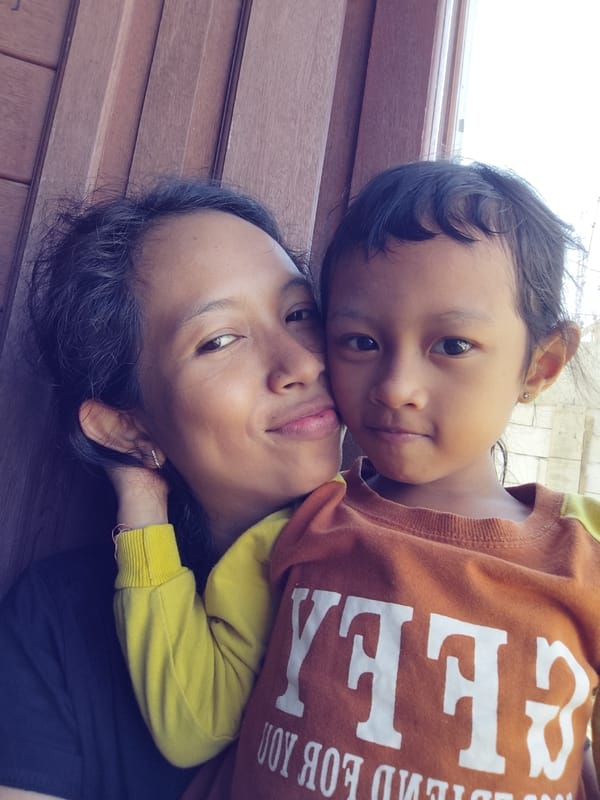 Kids, selfies, and a sleepy tabby cat on a quiet morning