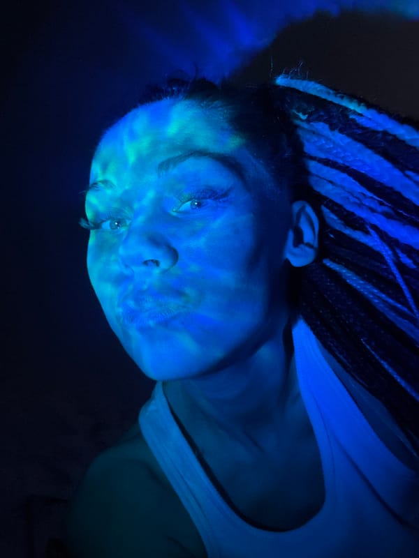 Woman photographed in colored light portraits in Rusanovo
