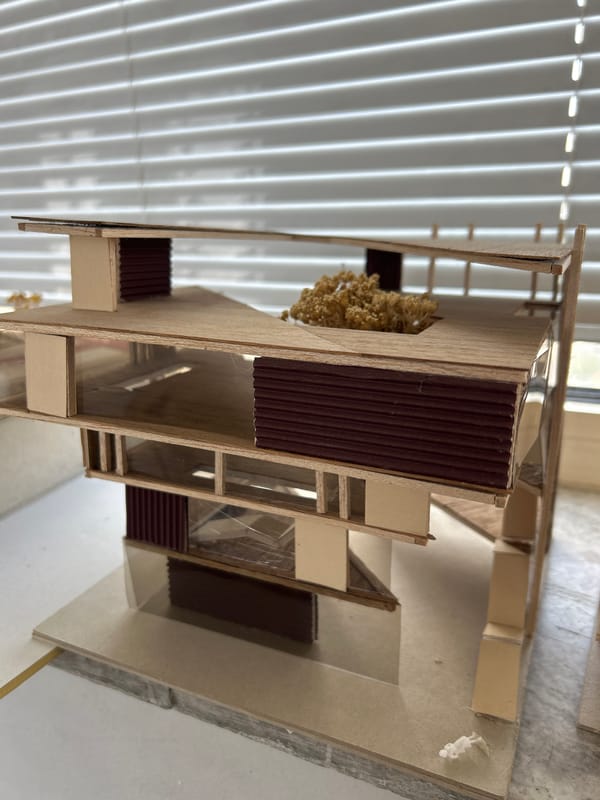 Architecture student documents scale models and design work in Sofia
