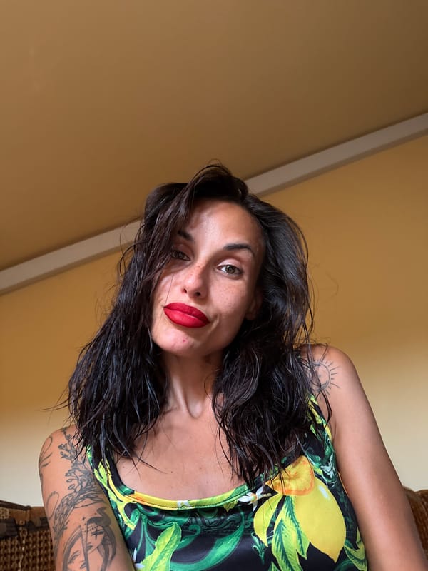 Lemon-print top and red lips in Pleven, Bulgaria