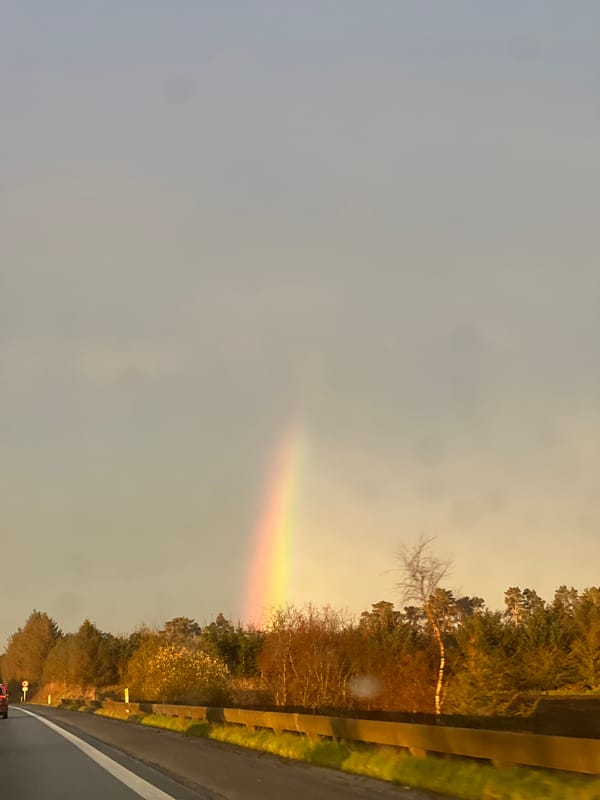 Partial rainbow spotted over highway in Ellidshøj, Denmark