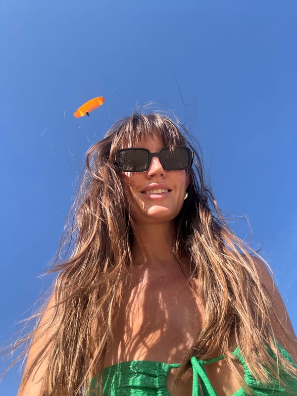 Morning beach activity and paragliding observed in Kuta Selatan