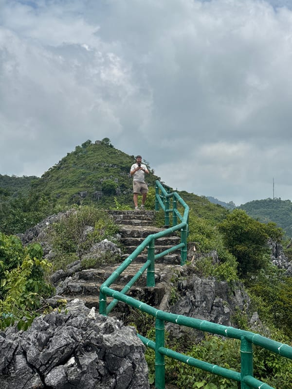 Hiking a hillside ruin above Tam Thanh Ward's rooftops