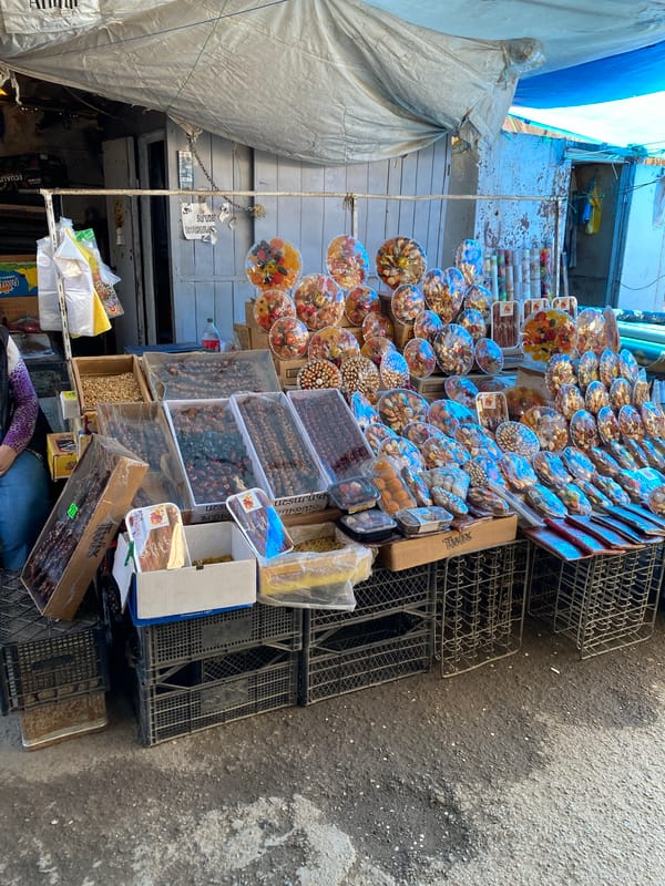 Woman shops for berries at morning market in Gyumri