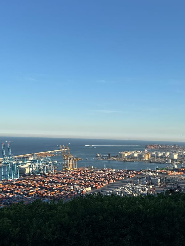 Aerial view captures Barcelona port activity under clear skies