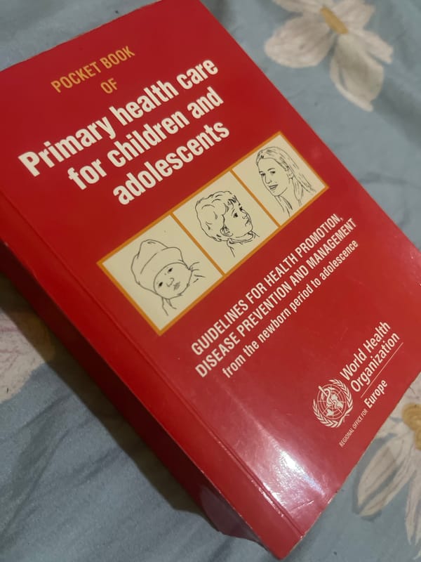 Healthcare worker handles medical guidebook and meal in Dar es Salaam