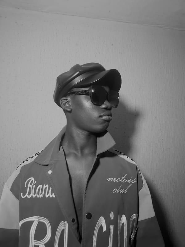 Person in racing jacket photographed indoors in Nkwelle, Nigeria