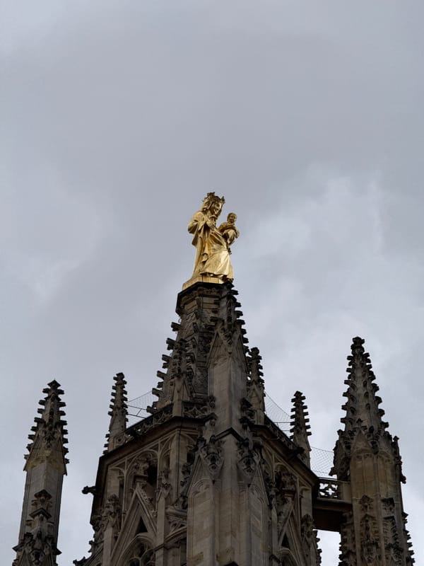 Tourist documents afternoon walking tour of historic Bordeaux landmarks