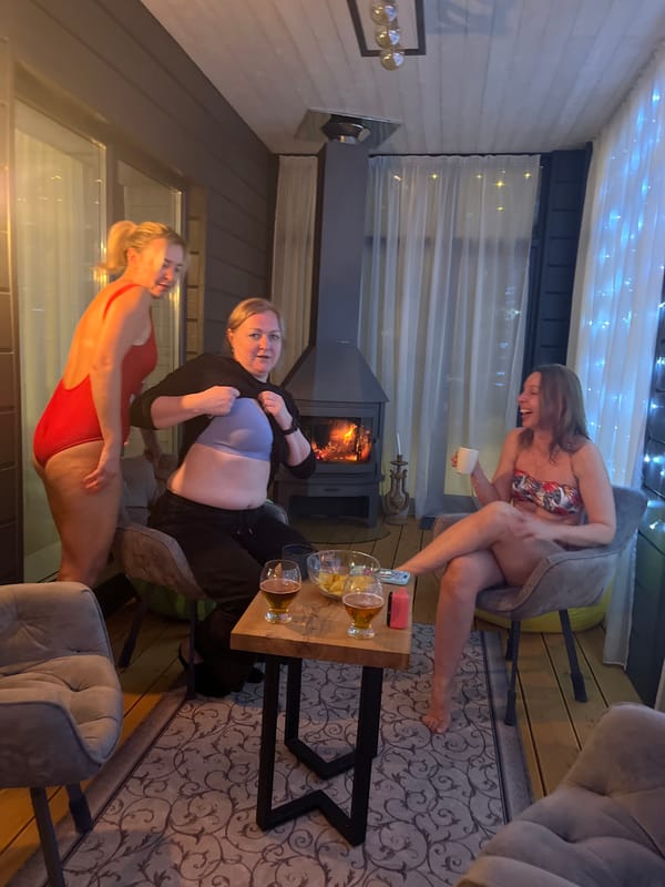 Women gather around outdoor fireplace in Russian town